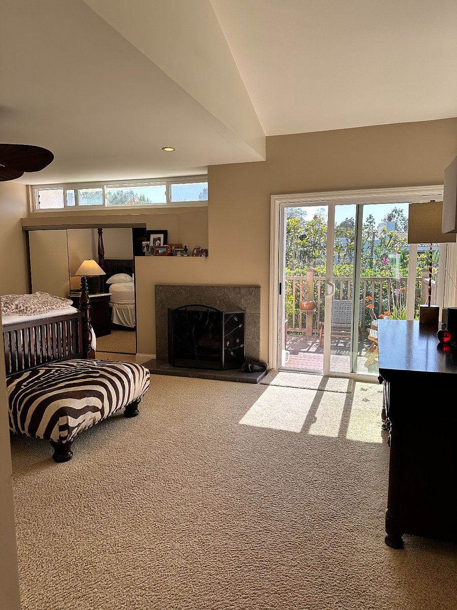 Master bedroom fireplace and access to the deck