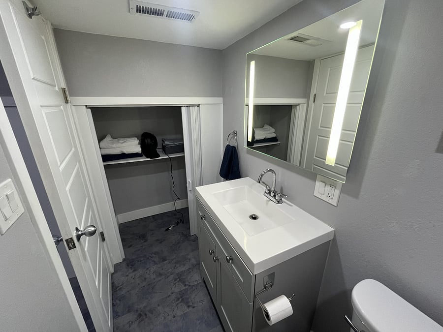 Bathroom with extra storage closet
