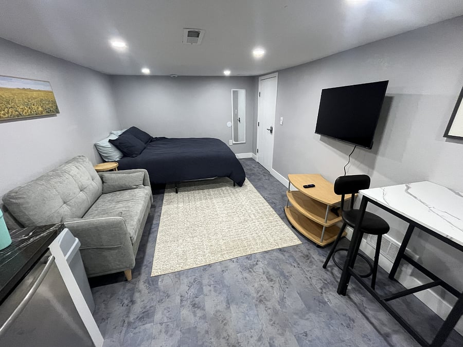 Comfy queen sized bed and adjustable mounted flatscreen smart TV.
