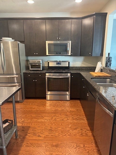 Contemporary kitchen with stainless steel appliances. Includes commercial cookware, Keurig, crockpot and airfryer.