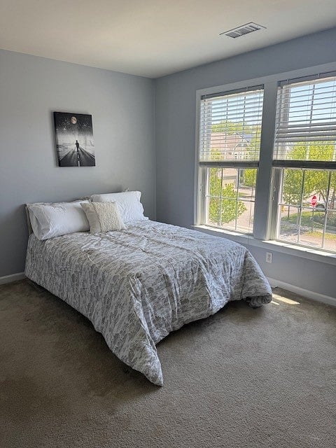 2nd floor bedroom with full bed and dresser.