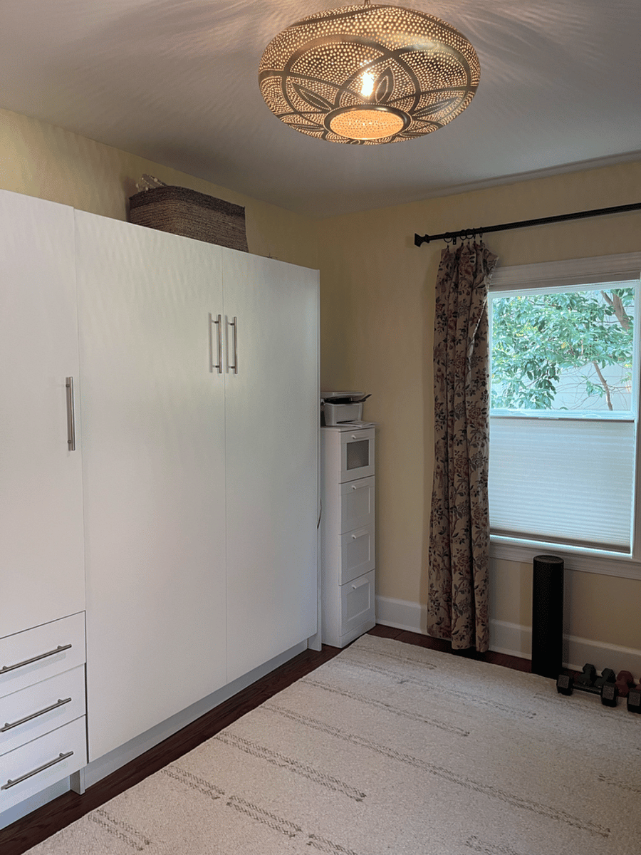 The second bedroom with Murphy Bed doubles as an exercise room with Peloton, Yoga mats, foam rollers and weights. Note the printer available for your use.