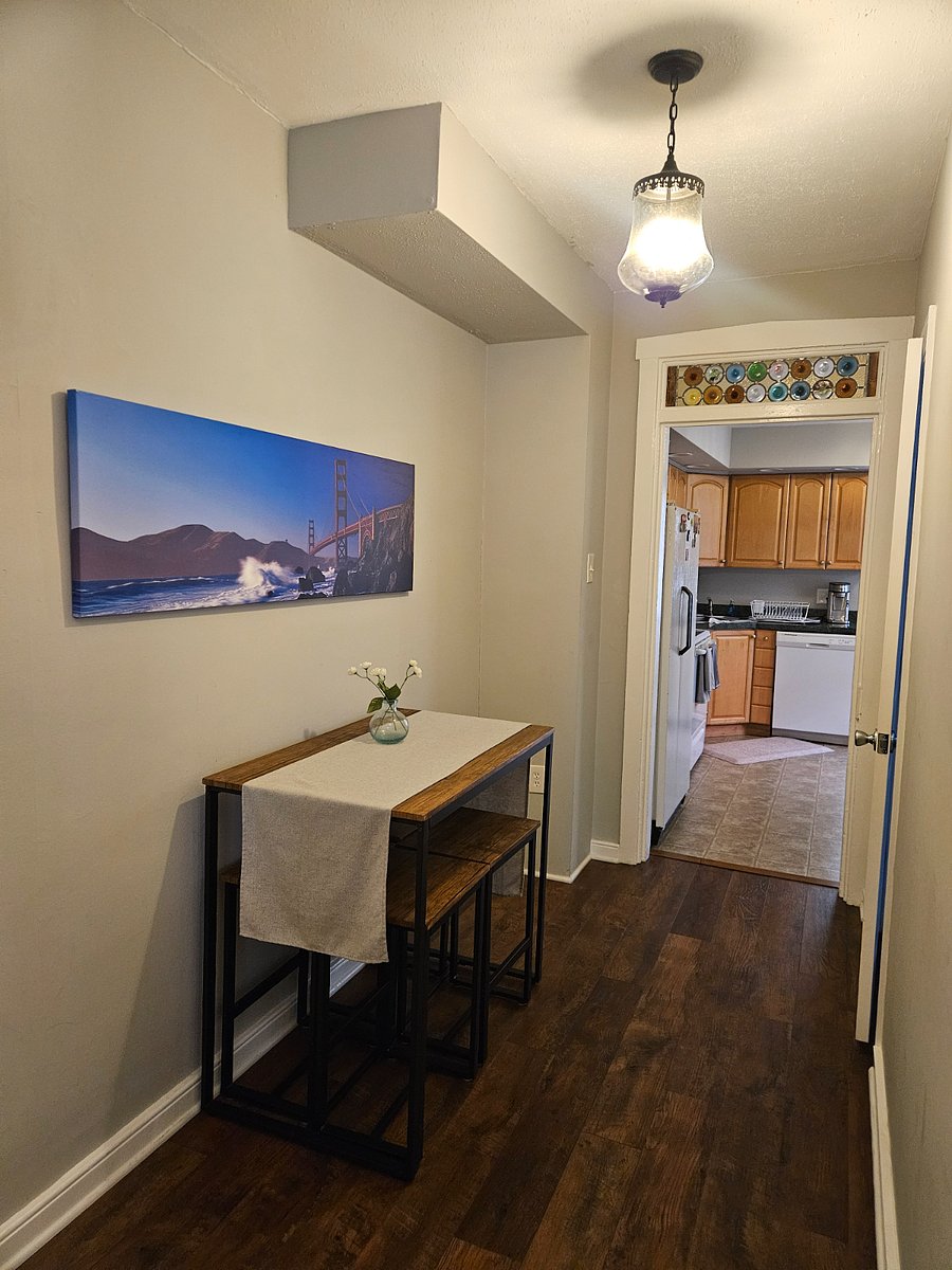 Hall with dining table that can accommodate 4 people.