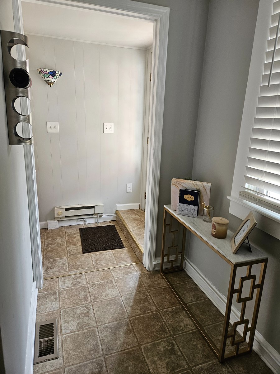 Back door entry from yard. Full bathroom here.