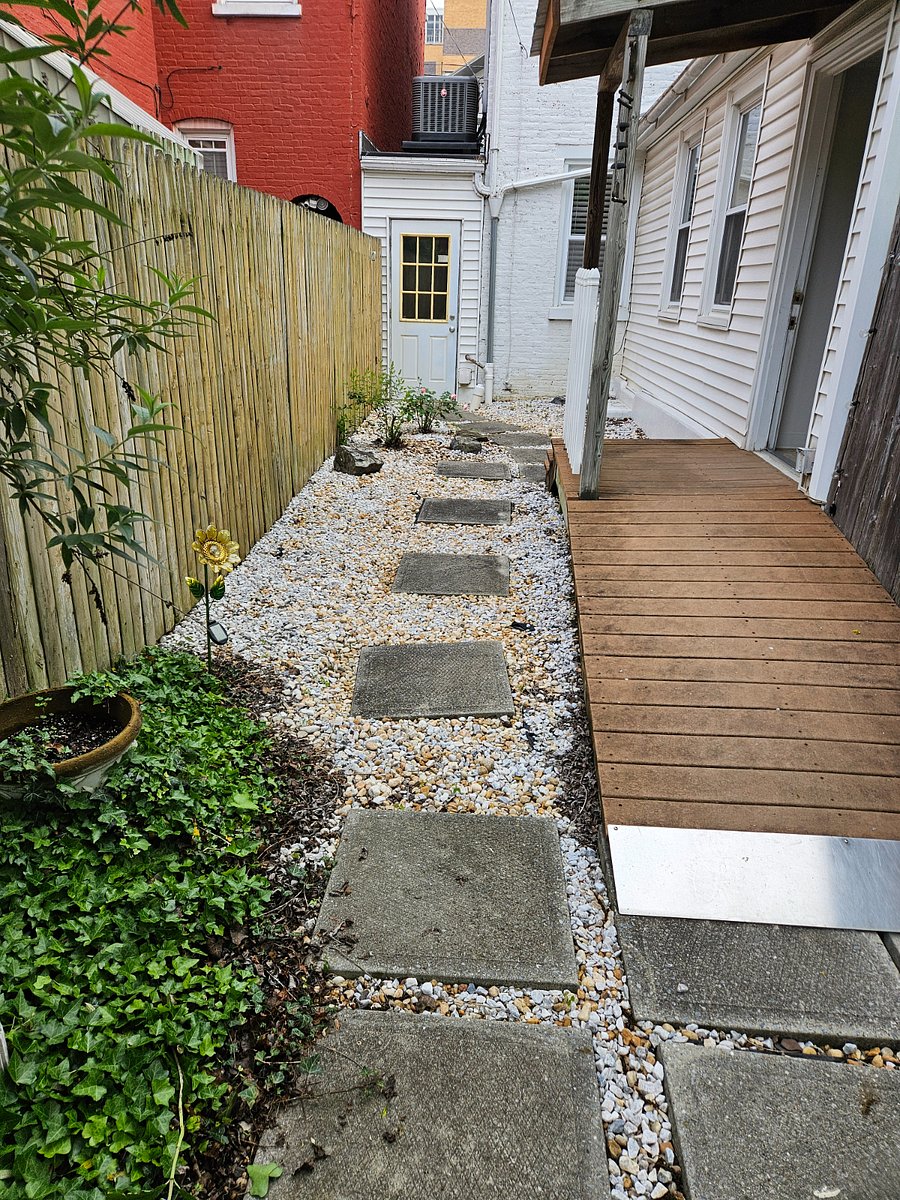Side yard and entry to private alley with laundry