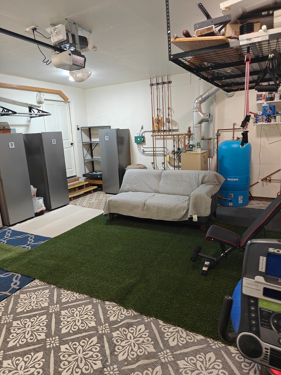 common space garage / gym, in picture is each individually allocated overflow freezer/fridge