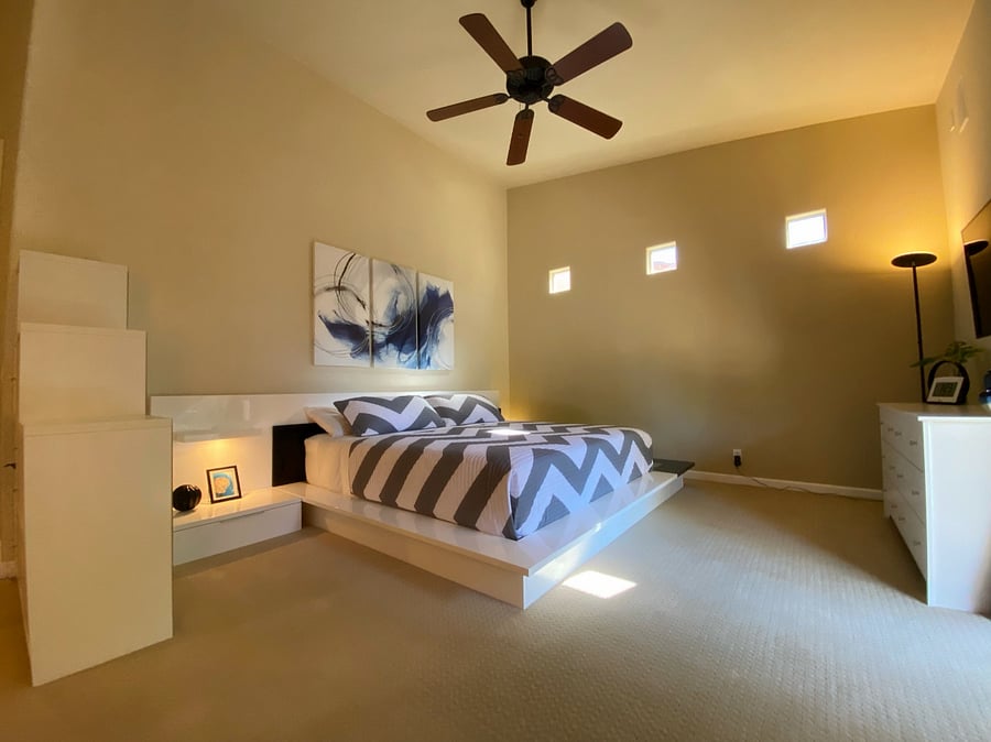 Primary Bedroom with High Ceiling and Natural Light