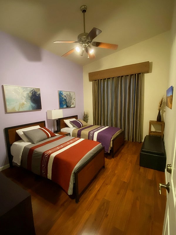 Guest Bedroom with High Ceiling and Two Twin Beds