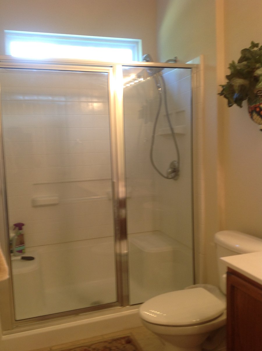 easy walk in shower with seat and shower head that easily reaches for personal bathing