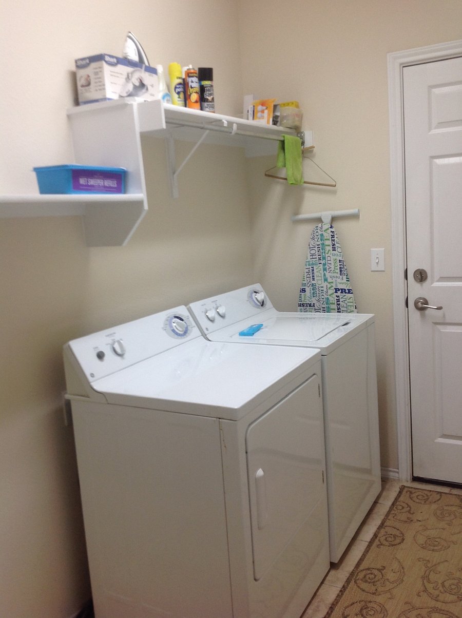 Laundry room located between kitchen and garage.  Full washer and Dryer, also vacuum and brooms and cleaning equip and supplies