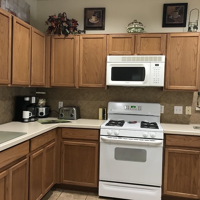 Full oven and stove (gas)
Microwave and air fryer 
cutting boards and knives.
pots and pans and glassware