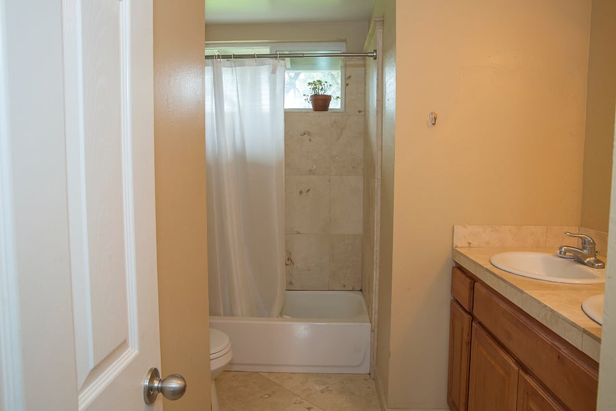 Your bathroom, sinks, shower, bath, toilet, toiletry storage.