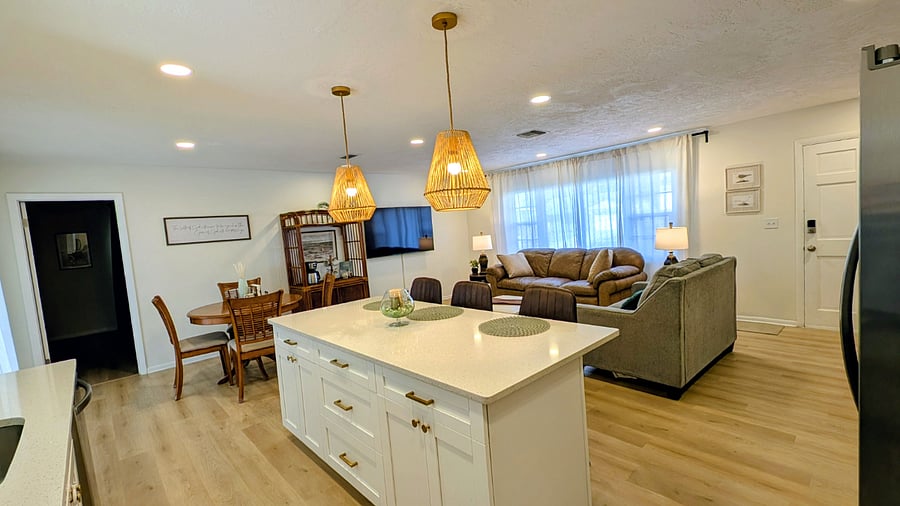 Kitchen island (seats 3) overlooking living room and dining room
