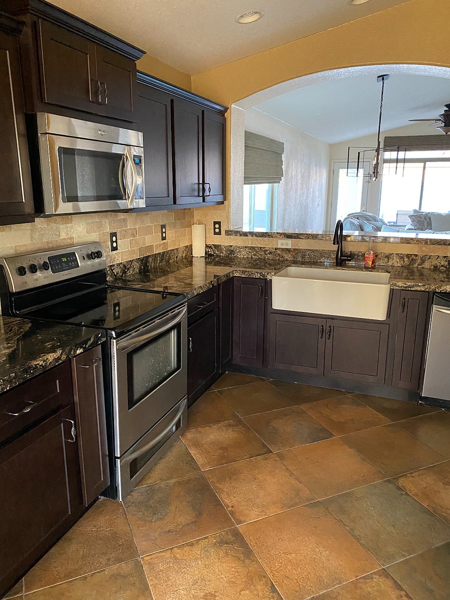 Kitchen - showing cooktop, oven, sink and other side of eating bar