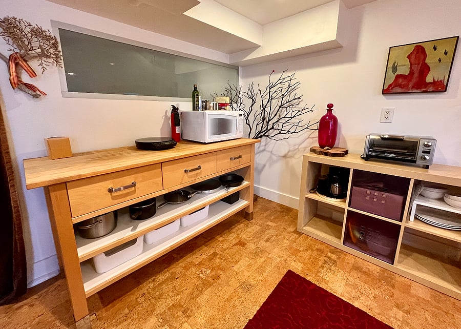 Microwave, toaster oven, and induction burner with all the necessary pots, pans, and utensils for cooking