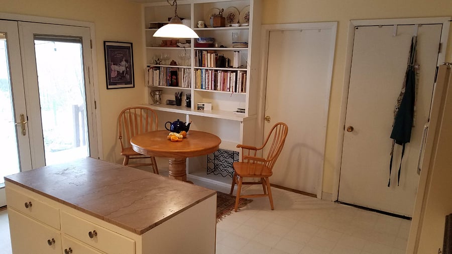 Kitchen table view. To the left are the glass double doors that lead to the back deck.