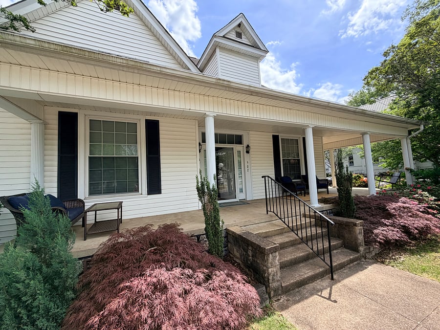Inviting front porch with plenty of seating. 