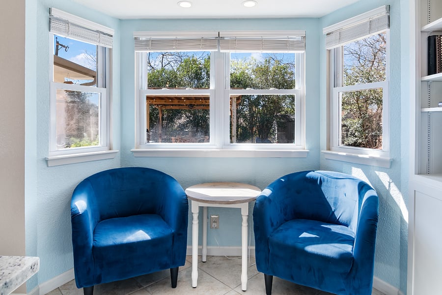 Breakfast nook featuring bay windows