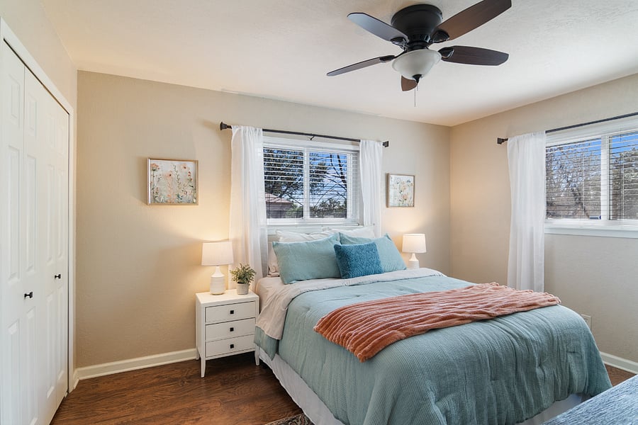 Primary bedroom with queen bed and two closets
