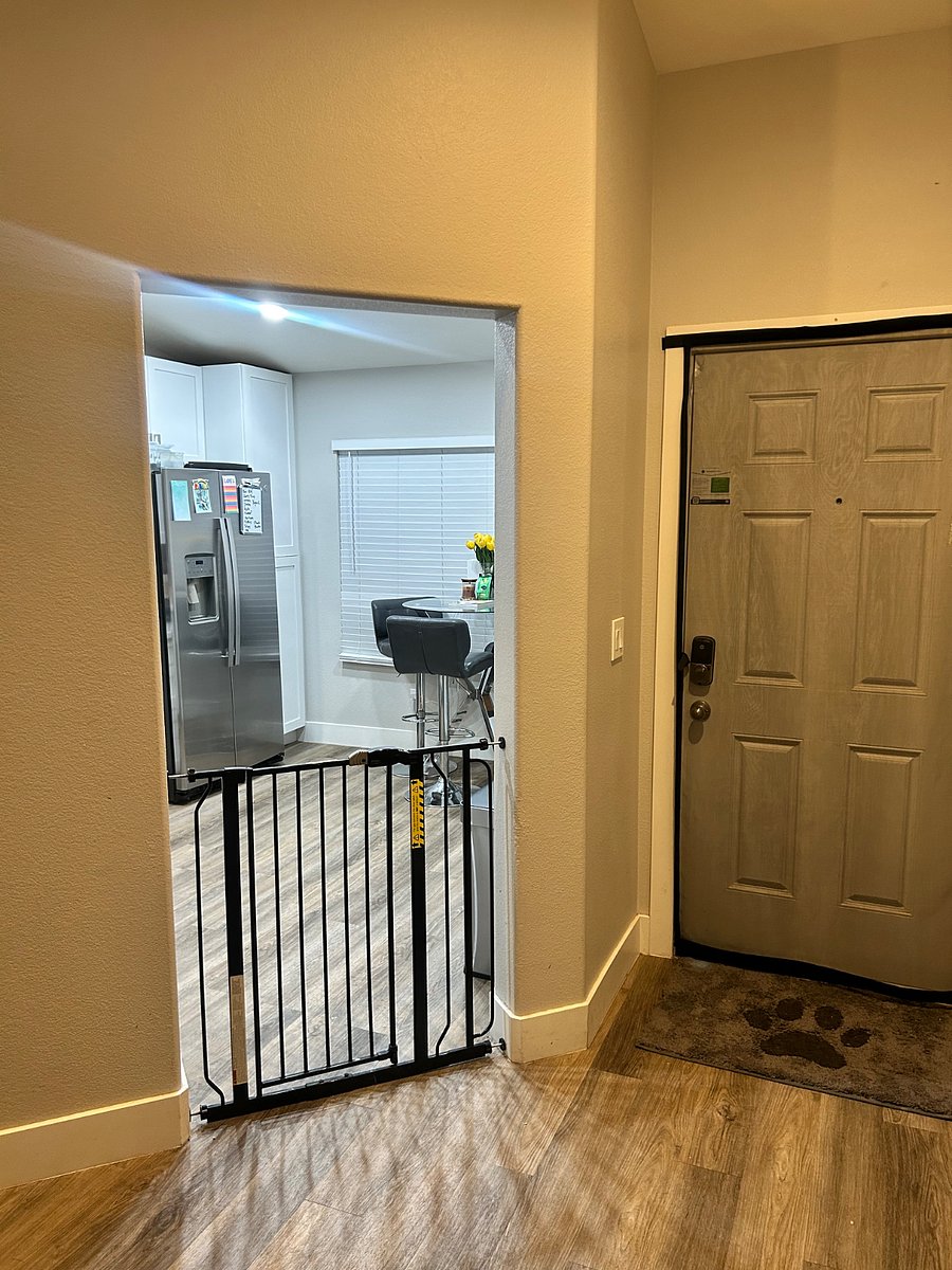 Front door next to kitchen 