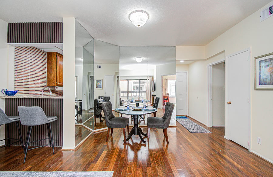 Spacious living area with hardwood flooring