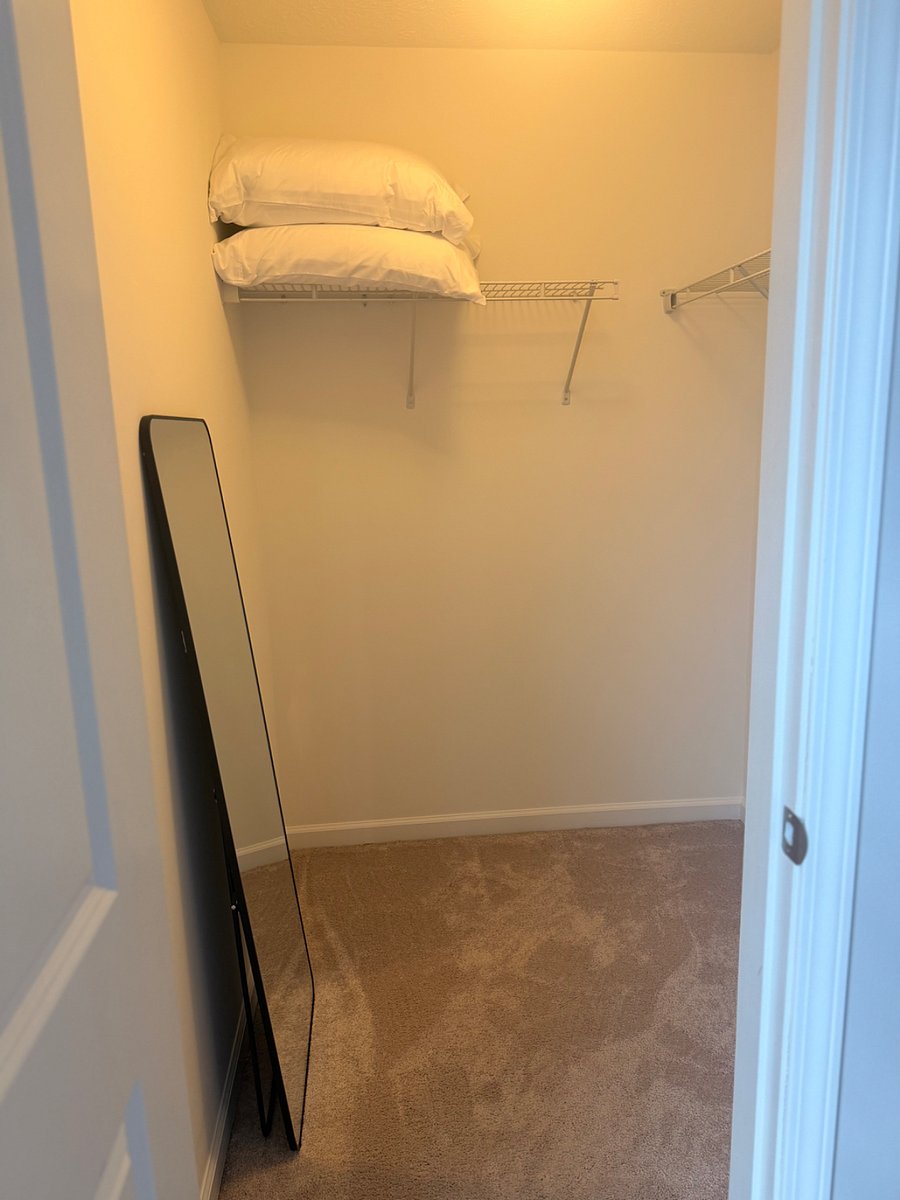 Upstairs first bedroom walk-in closet