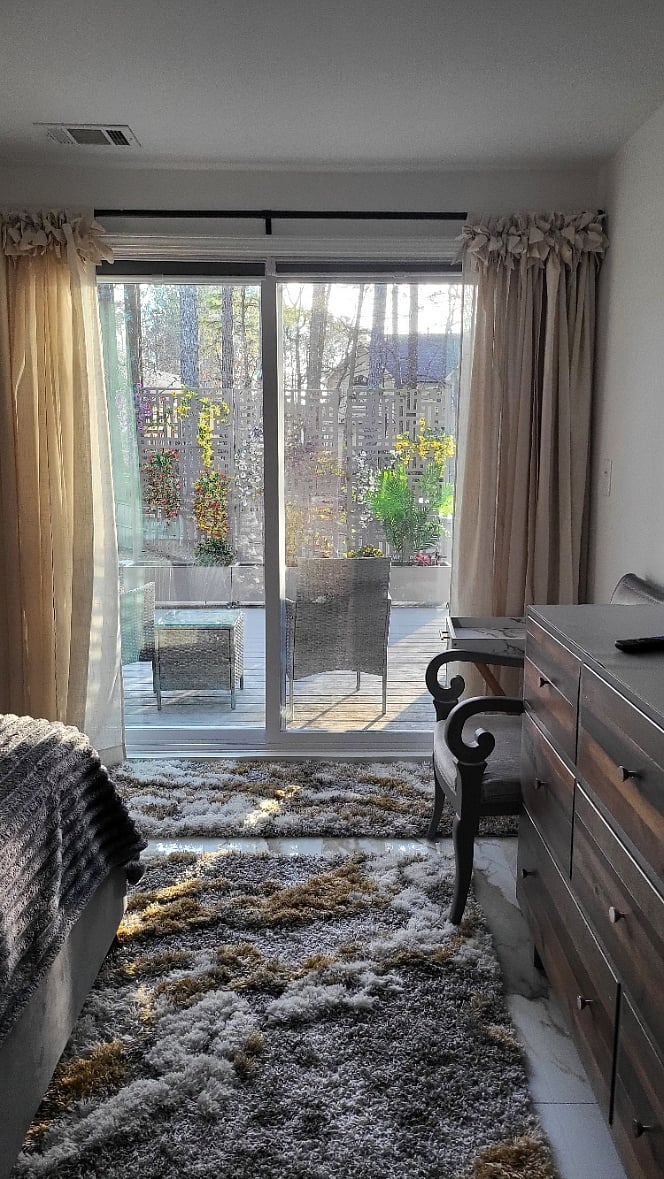 Primary Bedroom view and the exit to the patio set. Included.