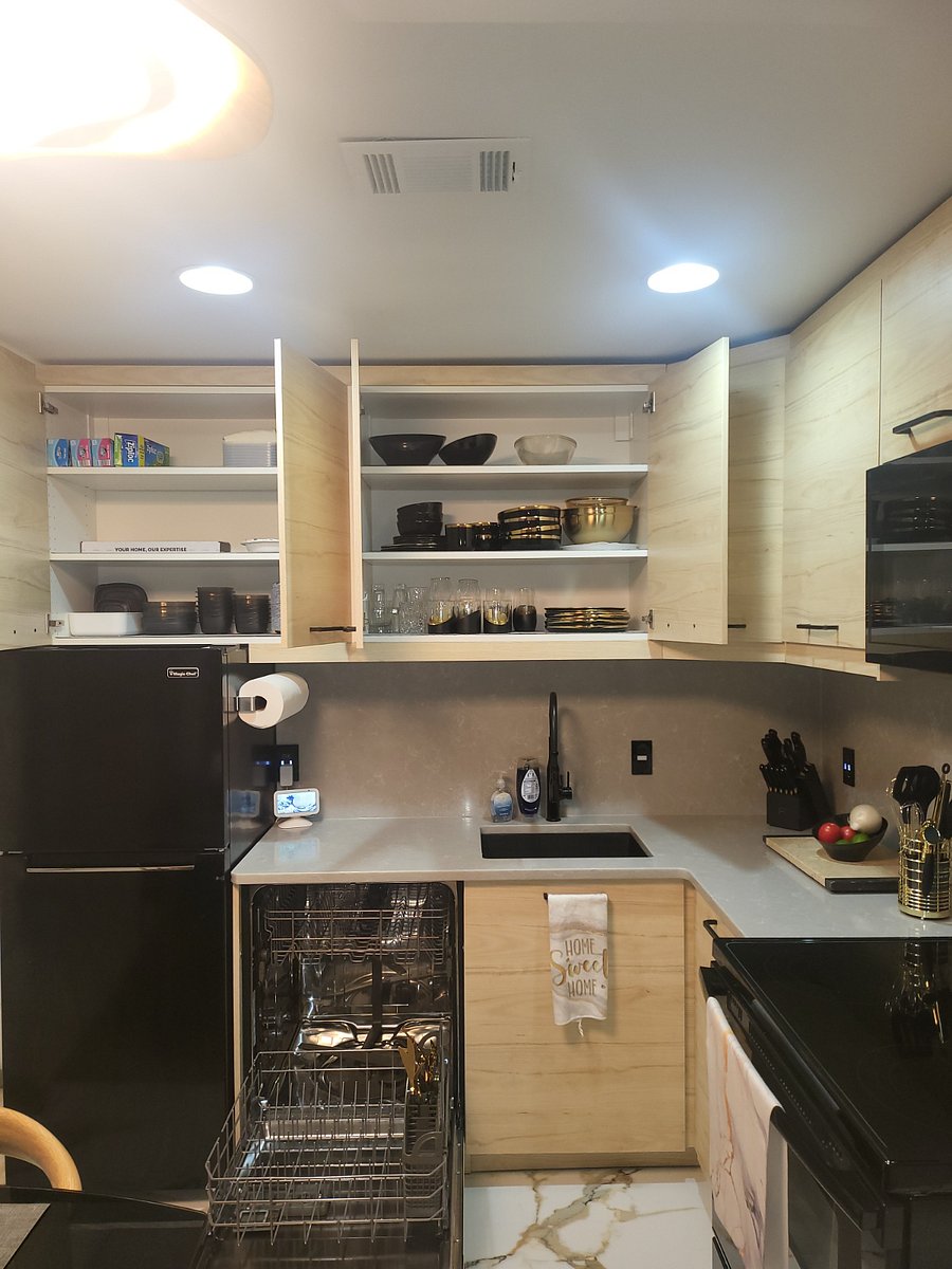 In the cabinets you'll find flutes & drinking glasses, plates, bowls, serving bowls, Tupperware, paper plates, toaster, and more. Wine glasses & coffee mugs are placed on the Kitchen wall shelves. You can have Alexa play your jambs while you cook!
