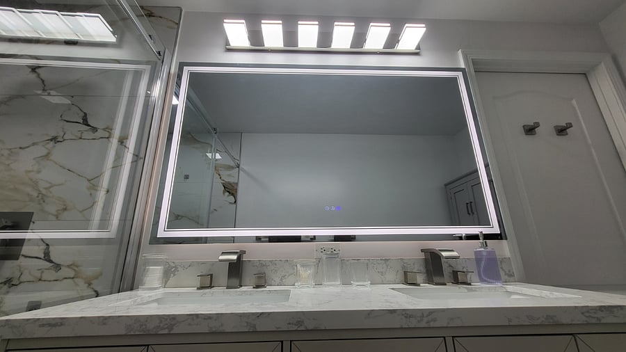 Fogless Mirror when showering, and light censored faucet showing hot (red), cold (blue), and warm (green). The mirror has 3 light settings for mood, vision, and make up.