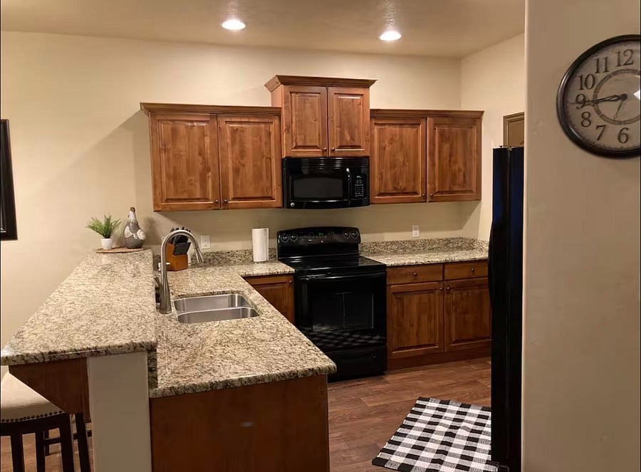Full kitchen with granite counters and gas range