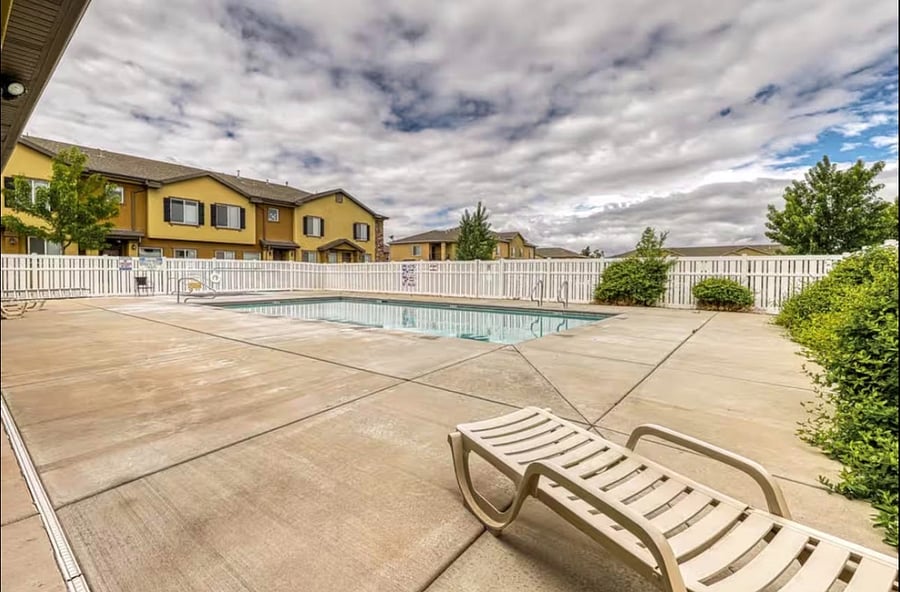 Community clubhouse with seasonal pool and sun deck