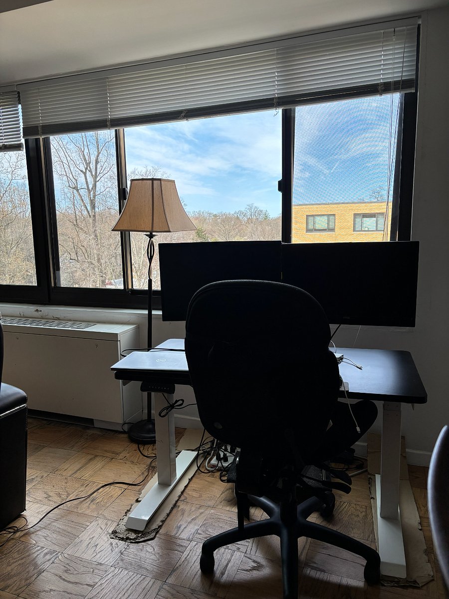 This desk has controllers to the right that go up and down with a button and the ability to pre-set heights with a digital height window to tell you where it is. The monitors are mounted and you can connect your laptop to them for a more ergonomic  experience. 