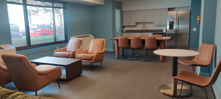 This is our community room. You need your key fob to access it. You can actually pay a reasonable fee to reserve this room for a party or event. It has a kitchen and bathroom in the space. The building occasionally has socials and will host here. They just updated all the furniture. It's beautiful!