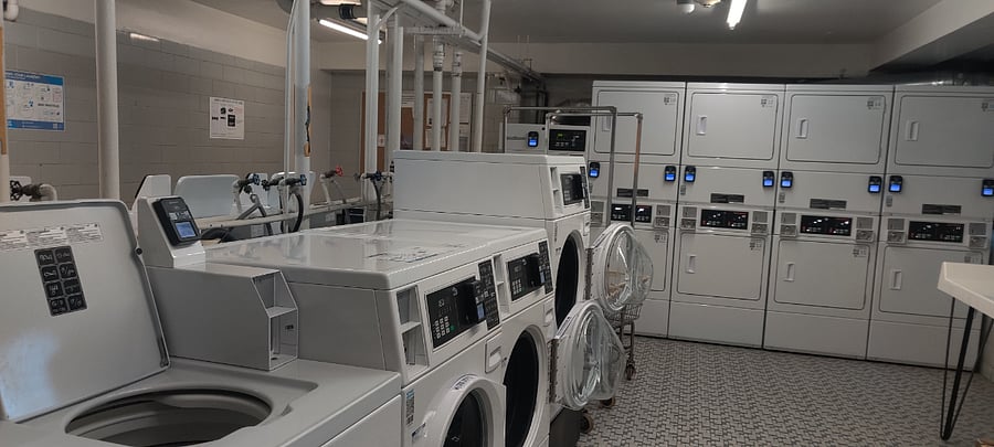 The laundry room is accessible 24/7. It takes credit cards and has an app so you don't need a million quarters. It's very affordable at $1.50 per load (wash or dry). It has front-liaders and top-loaders. People are very respectful of your things here. I've never had a problem.
