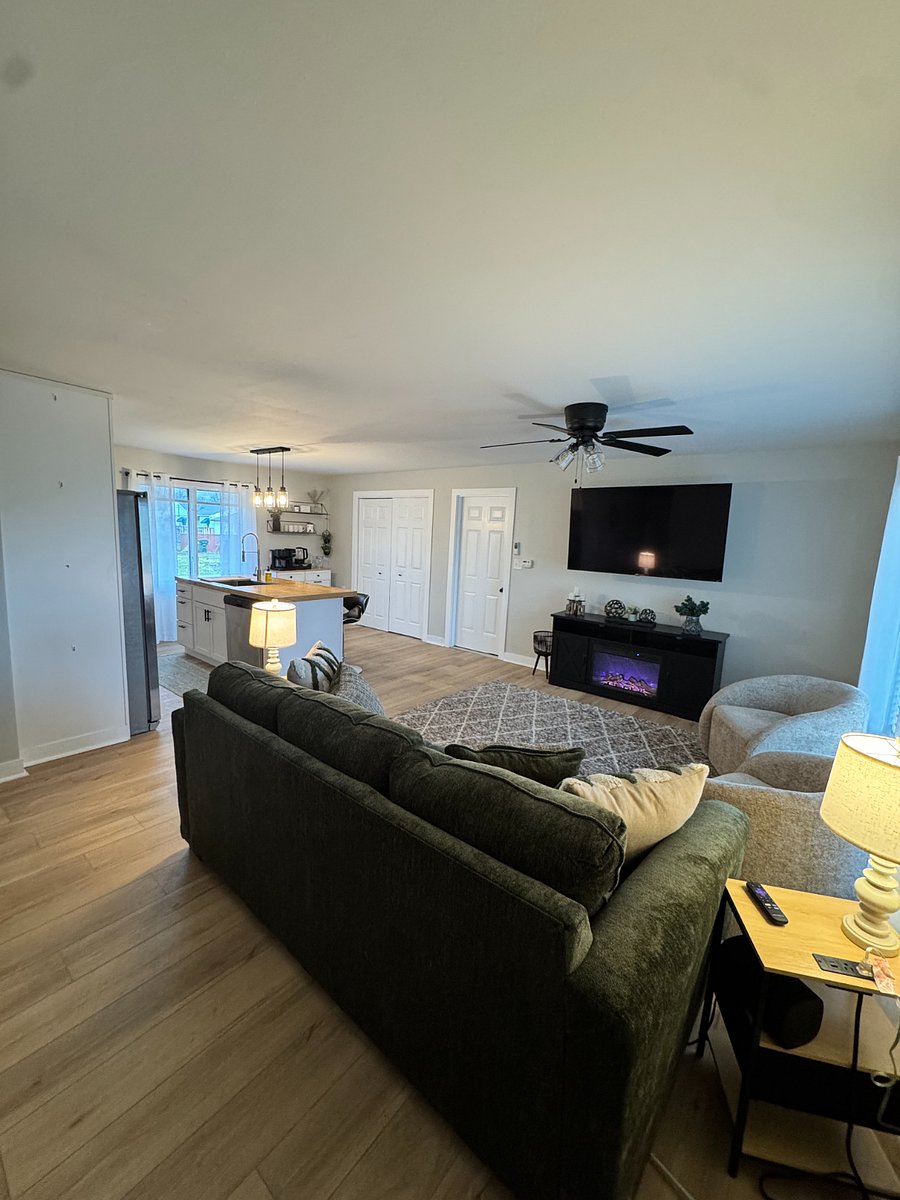 Living room with 65 inch Smart TV, electric fireplace