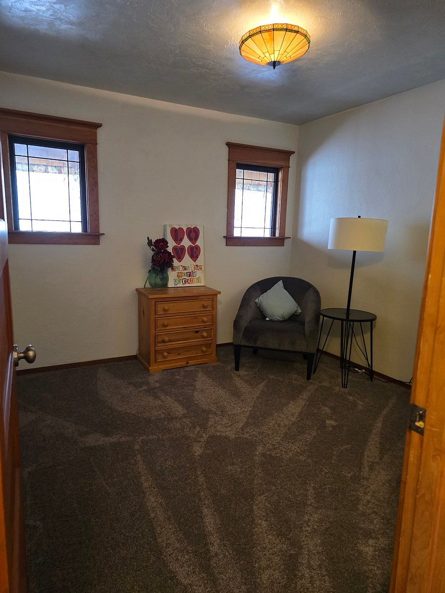 Second bedroom trimmed with Antique windows allow beautiful natural light to shine in.