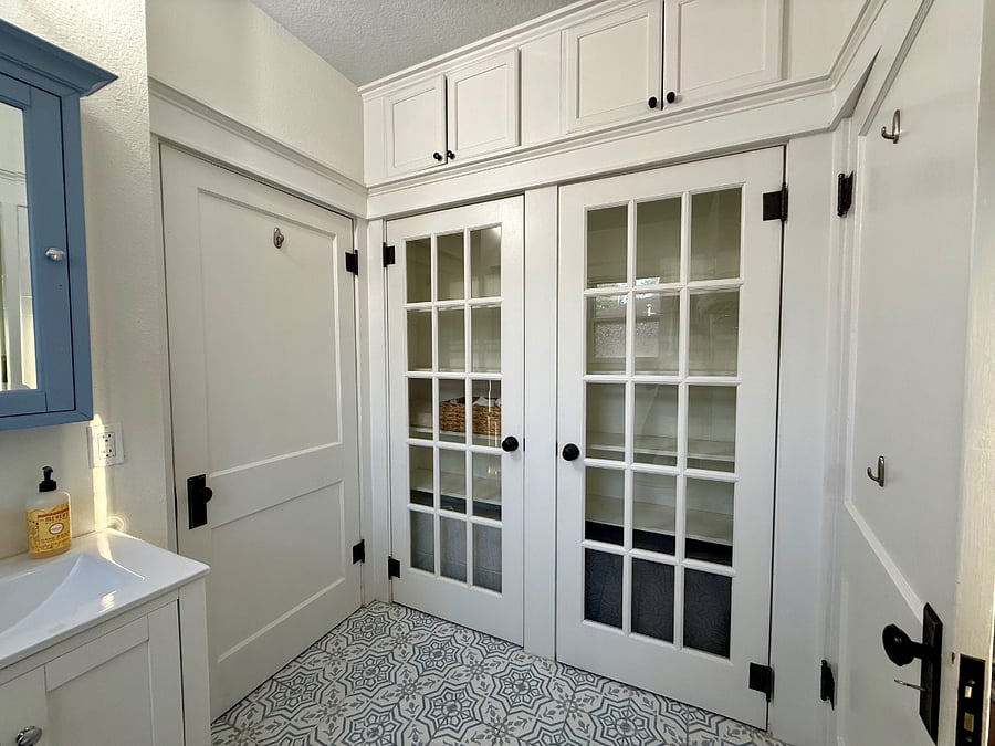 Primary bath oversized linen closet and additional overhead storage