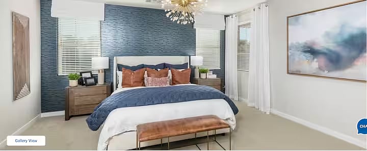 Spacious primary bedroom with king bed, large Samsung Smart TV, private en-suite bathroom, and plenty of closet space for extended stays.