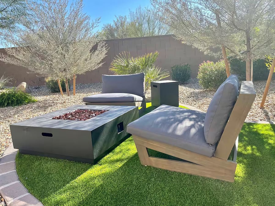 Private backyard with outdoor seating, propane fire pit, and BBQ grillperfect for relaxing after work or enjoying Arizona evenings.