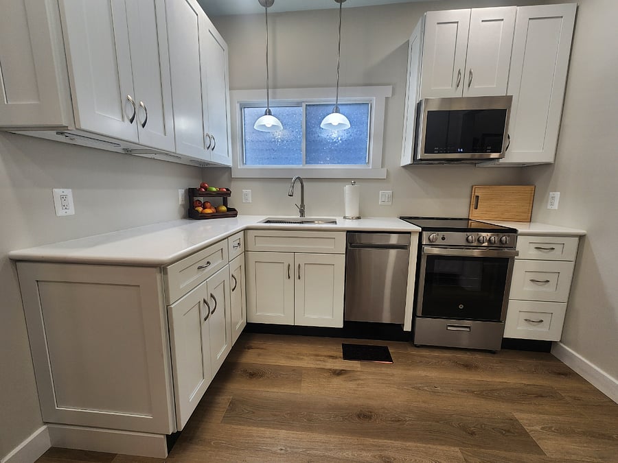 Fully equipped kitchen with dishwasher, stove, microwave and full size refrigerator.