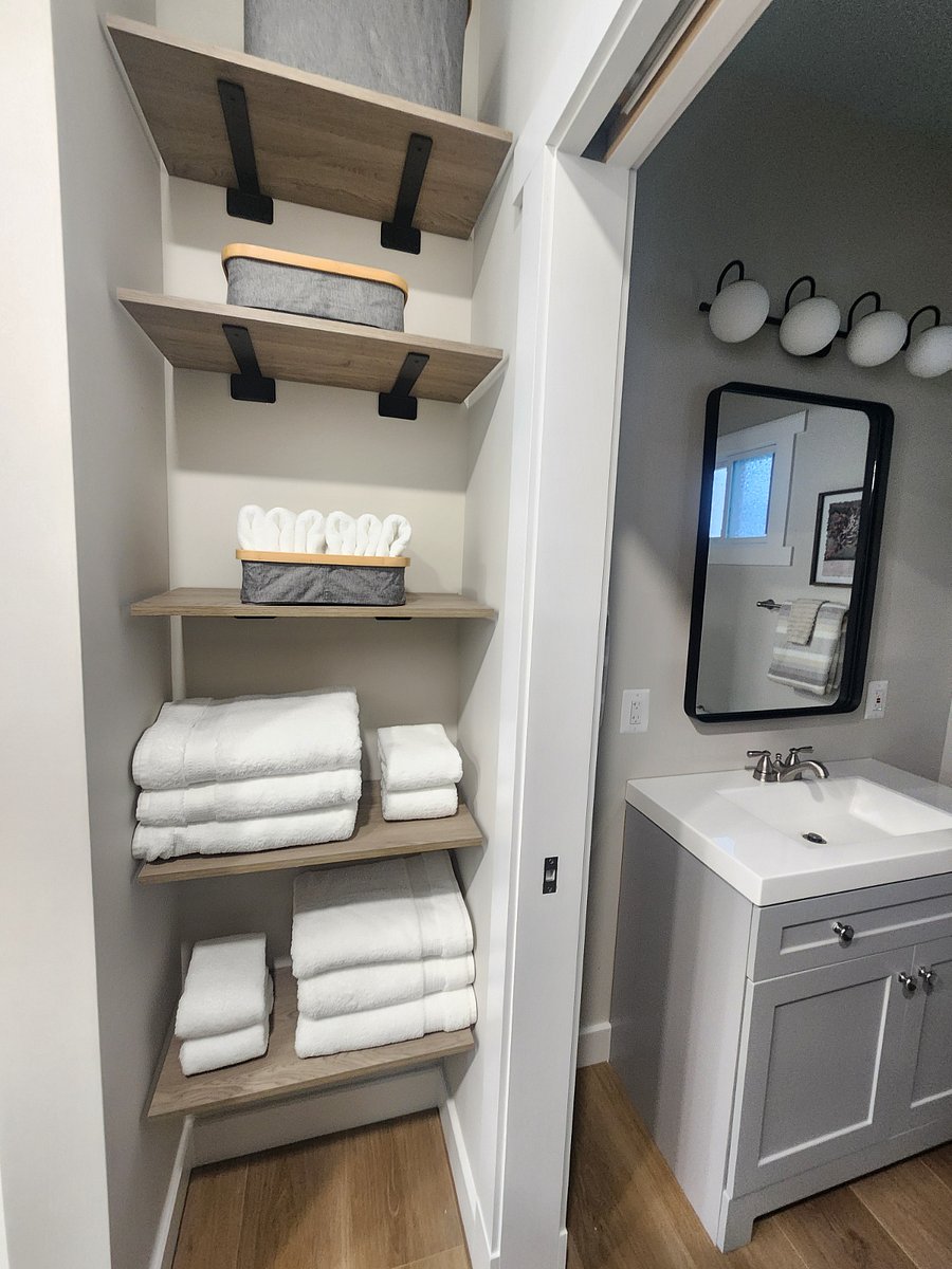 Storage area between kitchen and bath that can meet the needs of a pantry and/or linen closet.