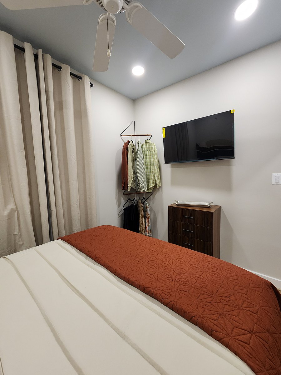 Bedroom #1 Hanging space in corner and smart TV.