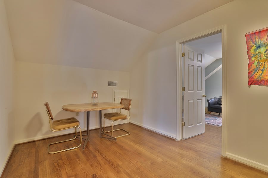 Specious upstairs landing with a table and two chairs 
