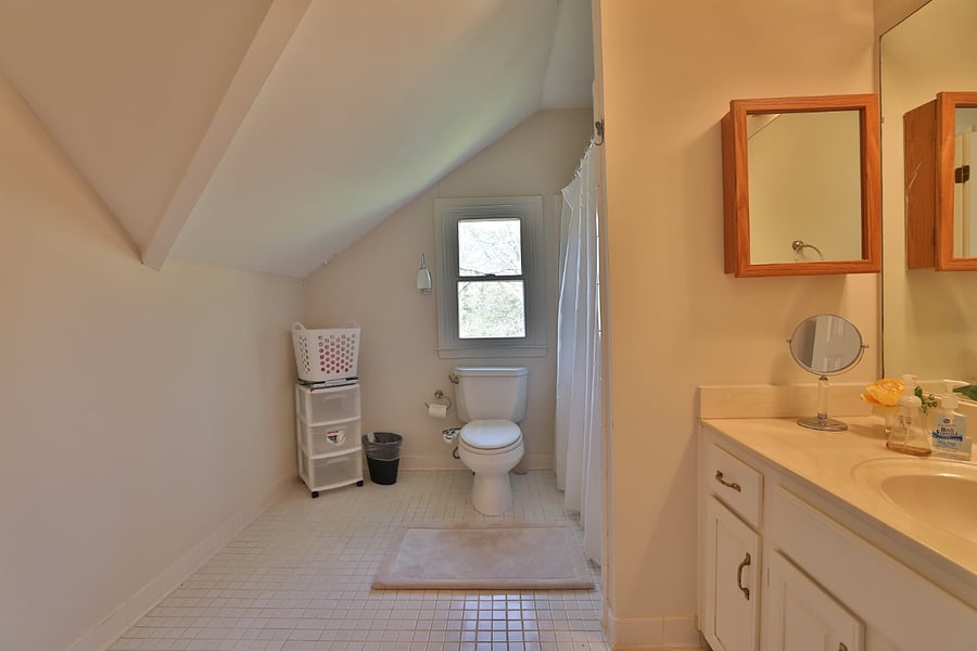 Shared full bathroom with shower and tub 