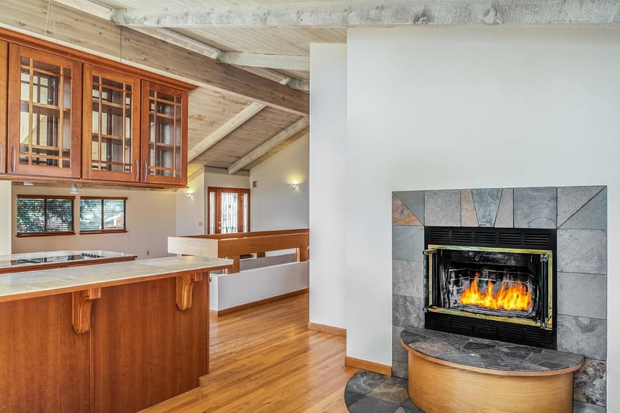 Den. Fireplace w/candles. No fire.