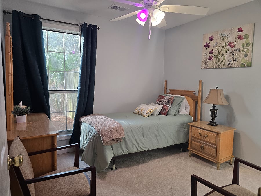Twin Bed with Memory Foam Mattress, two comfy chairs, smart ceiling fan lights, and smart lamp.