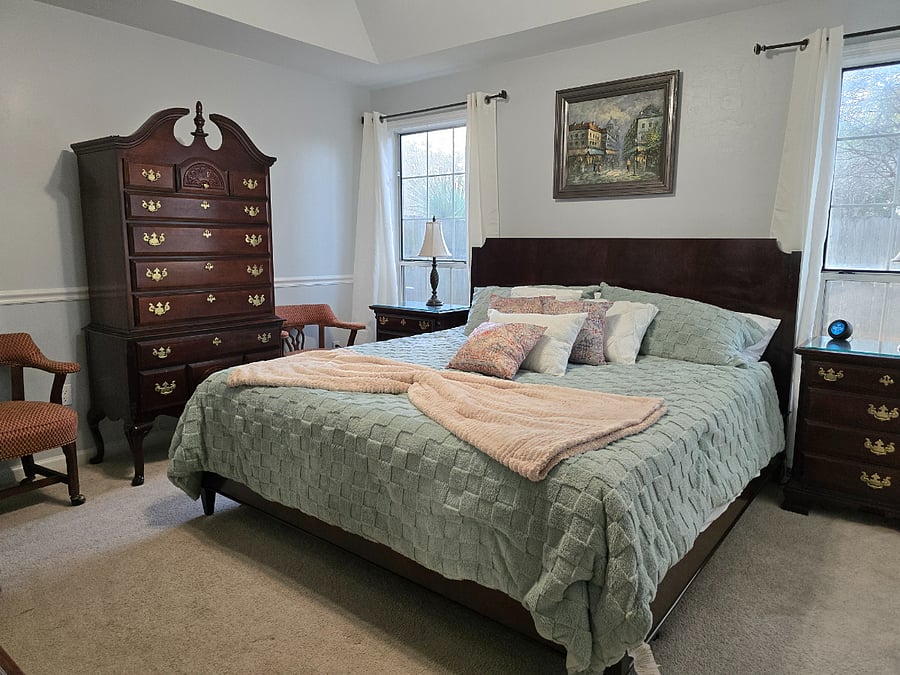 Main bedroom with 42" Smart TV, smart ceiling fan lights, smart lamps, and en-suite bathroom.