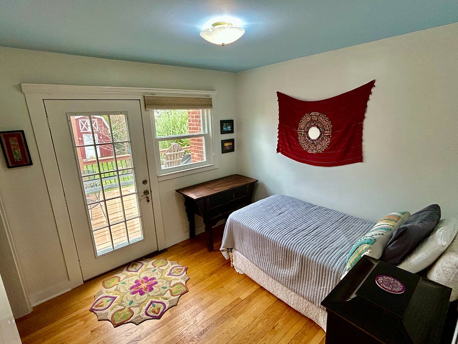 Bedroom with direct access to the back deck and yard
