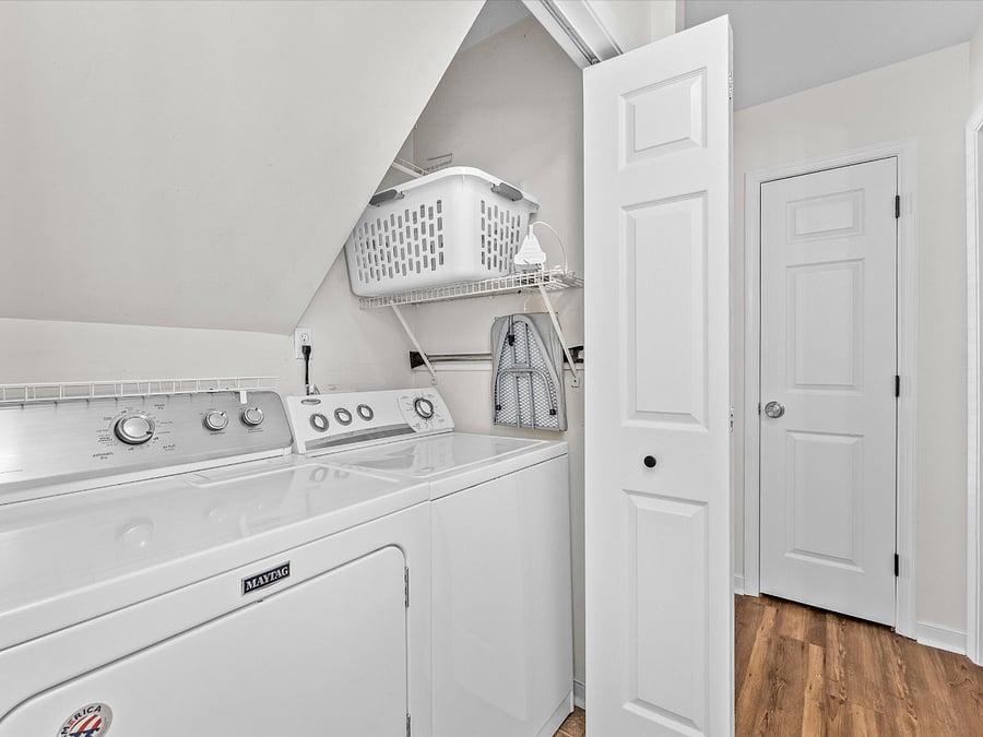 Full size washer and dryer located in downstairs hallway.