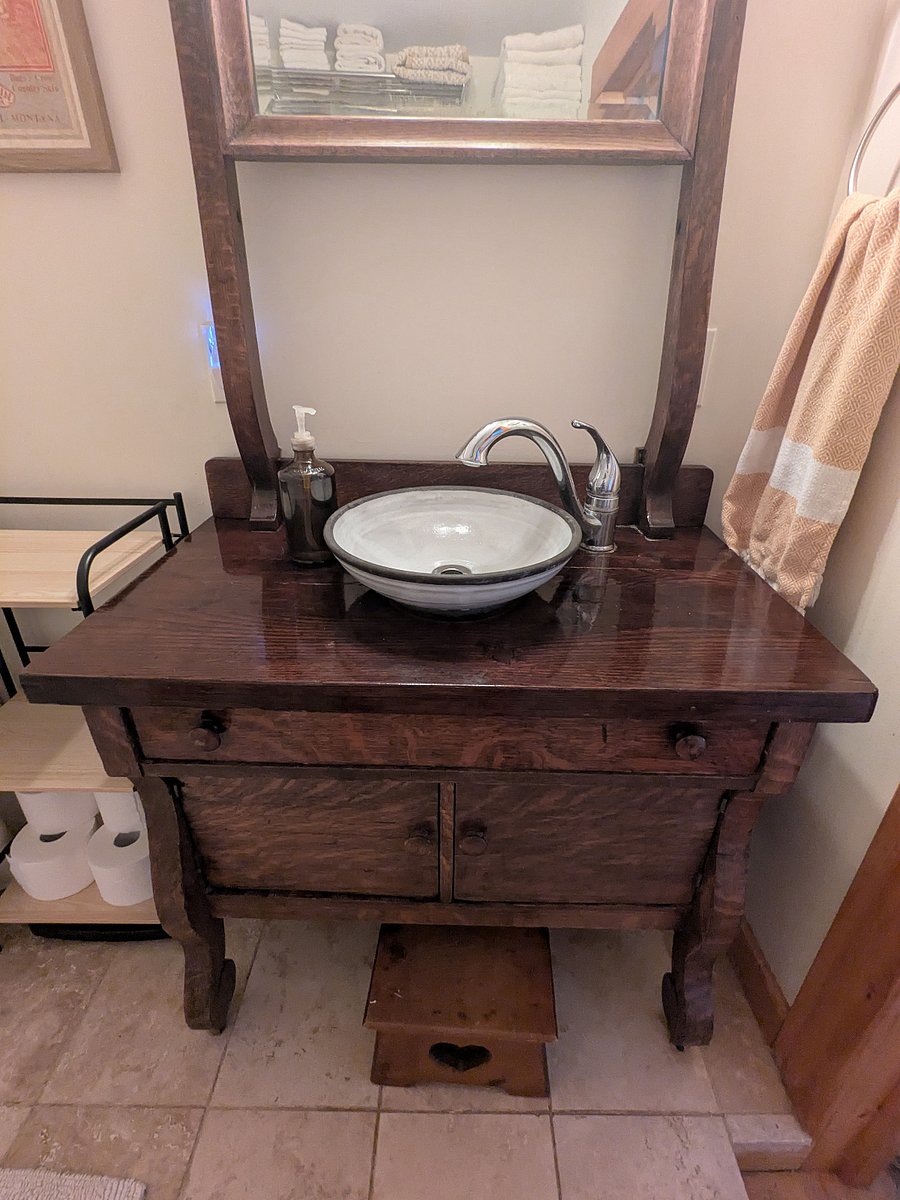 Vintage vanity with custom local pottery sink.